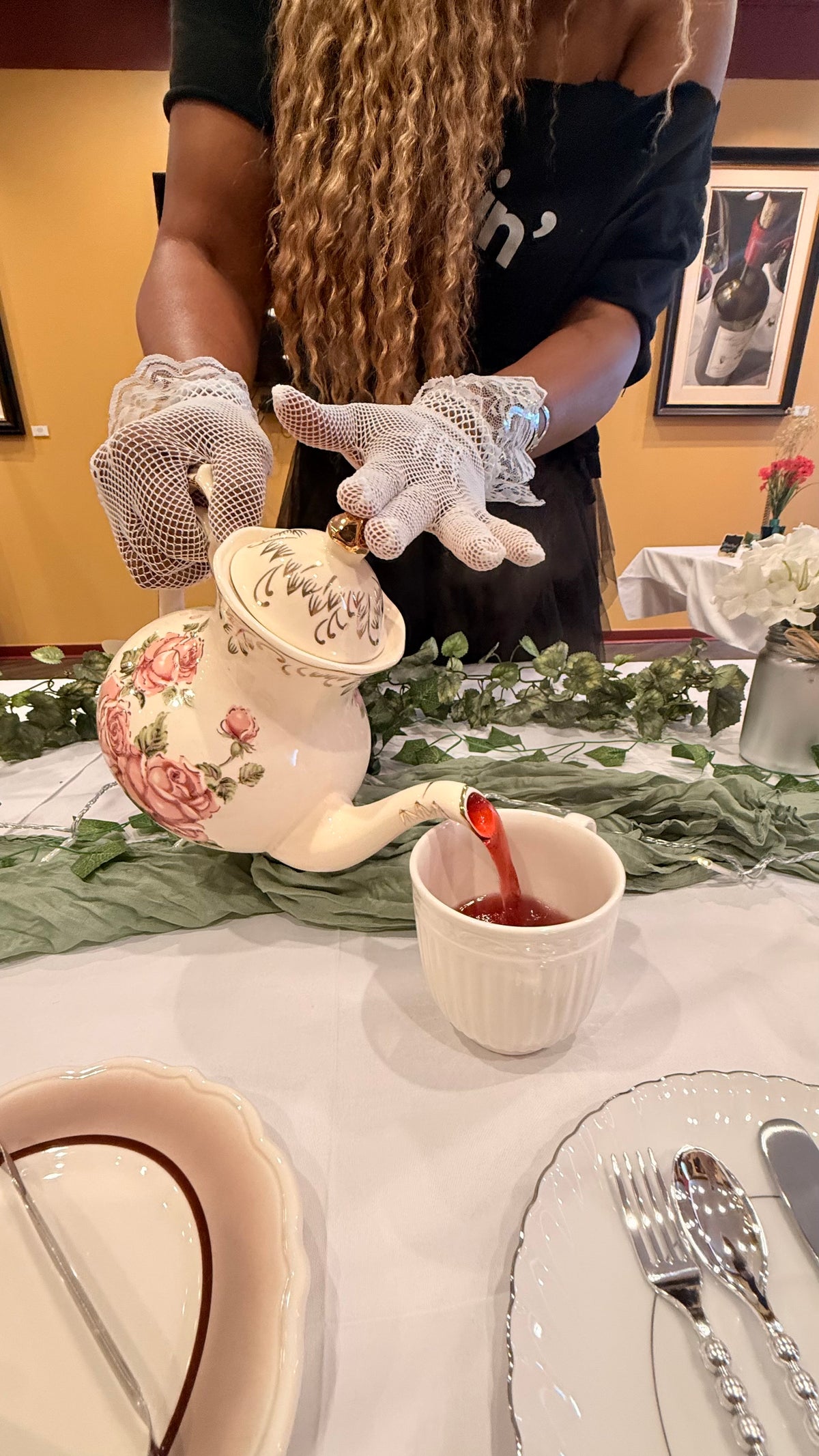 Tea being poured at the Graphic Tea Party